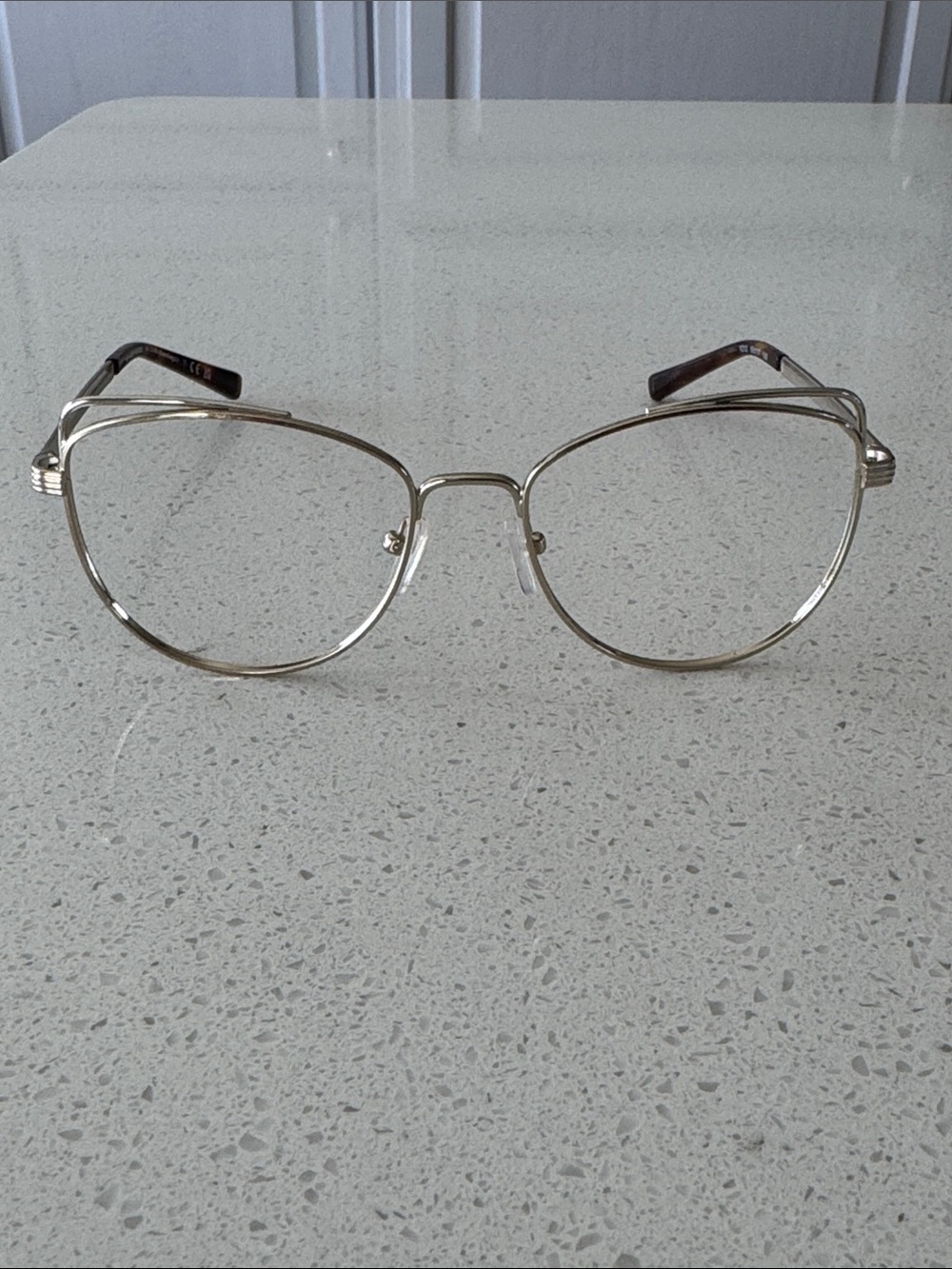 Classic Women's Gold Metal Frame Michael Kors Eyeglasses, no lenses.